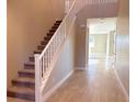 Staircase with white railing and carpeted steps at 9813 Belikove Manor Ave, Las Vegas, NV 89178