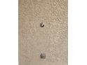 Close-up view of ceiling texture and light fixture at 1013 Adobe Flat Dr, Henderson, NV 89011