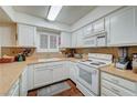 Bright kitchen with white cabinets, laminate countertops and tile backsplash at 2725 S Nellis Blvd # 2108, Las Vegas, NV 89121