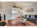Open-concept living room with hardwood floors and a view into the kitchen at 2725 S Nellis Blvd # 2108, Las Vegas, NV 89121