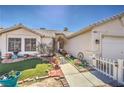 Cozy single-story home featuring desert landscaping, a quaint walkway, and a welcoming facade at 4357 Valley Regal Way, North Las Vegas, NV 89032