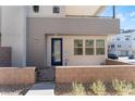 Private entrance with a modern blue door and brick walkway at 655 Spotted Falcon St, Las Vegas, NV 89138