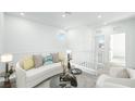 Cozy loft space with comfortable seating, neutral decor, and ample natural light at 657 N Water St, Henderson, NV 89015