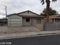Modest single-story home with fenced yard, practical parking, and convenient access in a friendly neighborhood at 1929 Evelyn Ave, Henderson, NV 89011