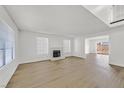 Spacious living room, featuring hardwood floors and fireplace at 108 Almendio Ln, Henderson, NV 89074