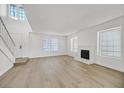 Bright living room with fireplace and light flooring at 108 Almendio Ln, Henderson, NV 89074