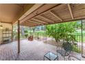 Outdoor patio area with brick floor, wrought iron fence, and view of the golf course at 3125 Pinehurst Dr # A, Las Vegas, NV 89109