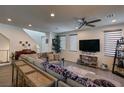 Bright living room featuring a large sectional sofa and stylish decor at 11273 Hidden Peak Ave # 101, Las Vegas, NV 89135