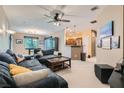 Open living room featuring neutral color scheme and view to the kitchen at 6868 Sky Pointe Dr # 2039, Las Vegas, NV 89131