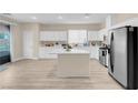 Modern kitchen featuring an island and stainless steel appliances at 11074 Caramel Crest Ct, Las Vegas, NV 89135