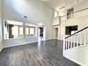 Bright living room with hardwood floors and views to other rooms at 11265 Newbury Hills Ave, Las Vegas, NV 89138