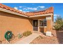 Front entrance with a security door and landscaping at 6370 Canyon Vista Ct, Las Vegas, NV 89156