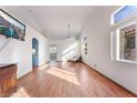 Bright living room with hardwood floors and vaulted ceilings at 6370 Canyon Vista Ct, Las Vegas, NV 89156
