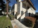 Condo building exterior with stairs and walkway, surrounded by landscaping at 1333 Del Mar St # 202, Las Vegas, NV 89119