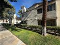 Attractive exterior of a two-story building with landscaping and walkways at 1333 Del Mar St # 202, Las Vegas, NV 89119