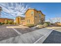 Charming townhome with desert landscaping, two-car garage, and ample parking space at 1065 Admiral Emblem St, Henderson, NV 89015