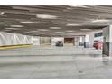 A spacious and well-lit parking garage with concrete walls and visible parking spaces at 3726 Las Vegas Blvd # 1902, Las Vegas, NV 89158