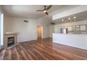 Bright living room features vaulted ceiling, ceiling fan, fireplace, and open layout at 4960 Harrison Dr # 214, Las Vegas, NV 89120