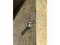 Close-up showcasing a well-lit building number and a stylish outdoor light fixture at 5317 Indian River Dr # 295, Las Vegas, NV 89103
