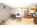 Bright dining room features tile floors, brick accents, and seamlessly connects to the kitchen at 3008 Saint George St # B, North Las Vegas, NV 89030