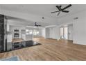 Open-concept living space with modern flooring, a fireplace and seamless access to the kitchen at 2606 Vegas Valley Dr, Las Vegas, NV 89121