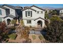 Attractive two-story home with a welcoming entrance, black wrought iron fencing, and desert-friendly landscaping at 10631 Sariah Skye Ave, Las Vegas, NV 89166