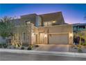 Modern two-story home with attached garage and manicured landscaping at 6411 Wild Blue Ct, Las Vegas, NV 89135