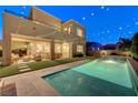 Inviting backyard oasis with sparkling pool and patio area at 6411 Wild Blue Ct, Las Vegas, NV 89135