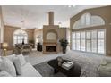 Spacious living room with fireplace and high ceilings at 2134 Eaglepath Cir, Henderson, NV 89074