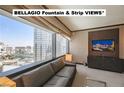 Luxury living room boasts breathtaking views of the Las Vegas Strip at 2600 W Harmon Ave # 24010, Las Vegas, NV 89158