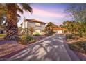 Well-manicured front yard with palm trees and landscaping leading to a charming home at 2868 Vista Del Sol Ave, Las Vegas, NV 89120
