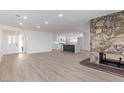 Bright living room with stone fireplace and hardwood floors at 2368 Winterwood Blvd, Las Vegas, NV 89142