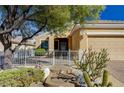 Charming single-story home featuring desert landscaping, neutral paint, and a welcoming front porch and fence at 2820 Goldcreek St, Henderson, NV 89052