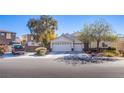 Two-story house with a double garage and landscaping at 5912 Sea Hunter St, North Las Vegas, NV 89031