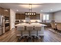 Modern kitchen with large island and stainless steel appliances at 6204 Gambetta St, Las Vegas, NV 89115