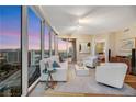Inviting living room with floor-to-ceiling windows showcasing a stunning city view, modern furniture and decor at 222 Karen Ave # 3307, Las Vegas, NV 89109