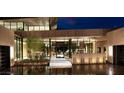 Modern entry with glass doors and desert landscaping at 7 Stoneshead Ct, Henderson, NV 89012