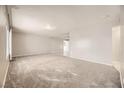 Spacious living room with grey carpet and neutral walls at 3187 Silver Saddle St, Las Vegas, NV 89169