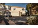 This home features a well-maintained exterior with a three-car garage and mature landscaping at 3368 Epson St, Las Vegas, NV 89129