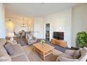 Living room with neutral tones, an open floor plan, and modern furnishings at 71 E Agate Ave # 207, Las Vegas, NV 89123
