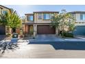 Charming two-story home with a well-manicured lawn, a two-car garage, and inviting curb appeal at 2947 Caxton Grove Dr, Henderson, NV 89052