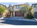Charming two-story home with a well-manicured lawn, a two-car garage, and inviting curb appeal at 2947 Caxton Grove Dr, Henderson, NV 89052