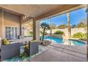 Relaxing patio overlooking the pool and landscape at 525 Summer Mesa Dr, Las Vegas, NV 89144