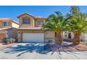 Charming two-story home with a well-manicured front yard, mature palm trees, and a two-car garage at 3628 Warmbreeze Way, Las Vegas, NV 89129