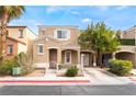 Charming two-story home featuring a stucco facade, well-maintained landscaping, and covered entry at 10332 Perfect Parsley St, Las Vegas, NV 89183