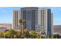 Platinum Hotel exterior view with palm trees under a blue sky at 211 E Flamingo Rd # 610, Las Vegas, NV 89169