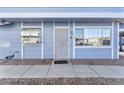 Condo's front door entrance with a welcome mat at 5330 Duralite St # 102, Las Vegas, NV 89122
