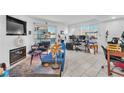 Spacious living room with blue sofa and workspace at 5330 Duralite St # 102, Las Vegas, NV 89122