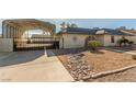 Single-story home with carport and landscaped yard at 5905 Paseo Montana, Las Vegas, NV 89108