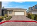 Single-story home with attached garage and landscaped yard at 3532 Labrusca Vines Ct, North Las Vegas, NV 89081